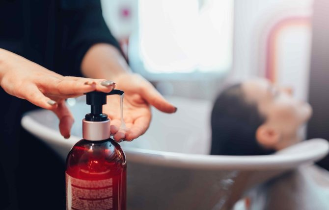 hairdresser-washes-customer-hair-with-shampoo-2024-12-04-22-37-29-utc-min