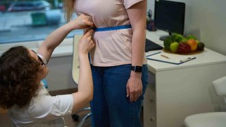 nutritionist-measures-the-volume-of-clients-body-w-2023-11-27-04-56-51-utc-min